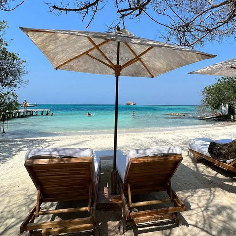 Guests relaxing on the pristine sands of Pao Pao Beach in Rosario Islands - Juan Ballena